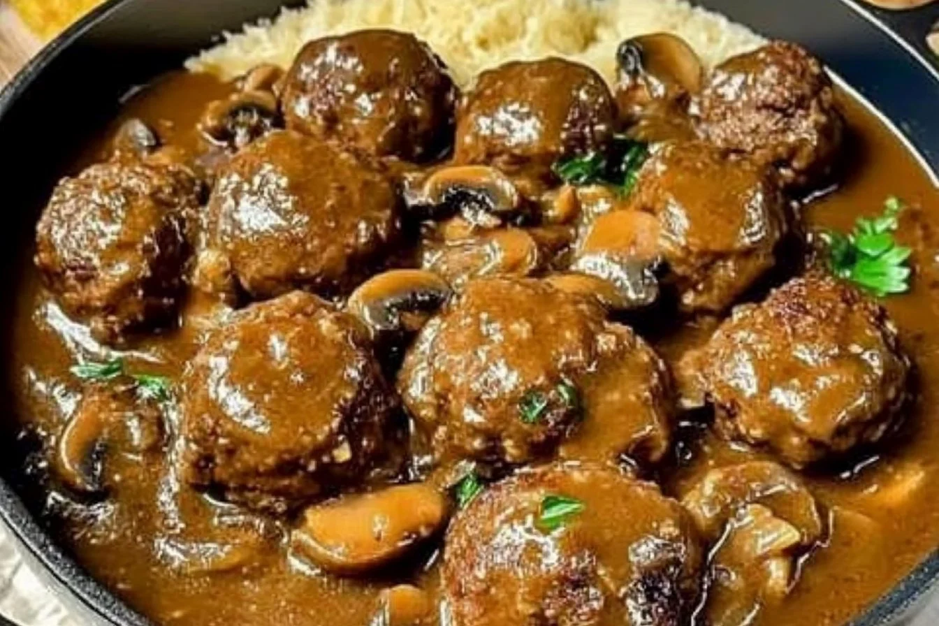 Delicious meatballs in creamy mushroom gravy served on a plate