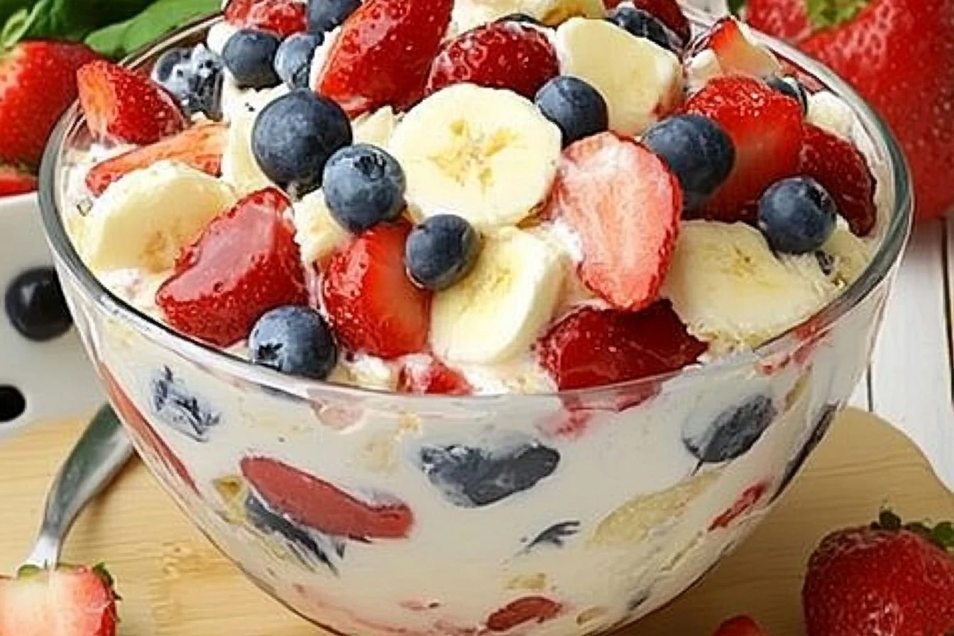Red White and Blue Cheesecake Salad with berries and creamy topping