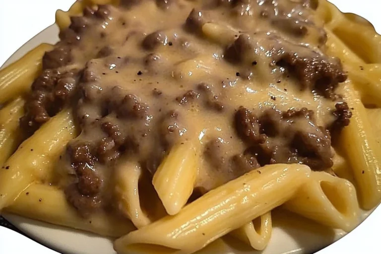 Delicious Sloppy Cheeseburger Pasta topped with cheese and fresh ingredients
