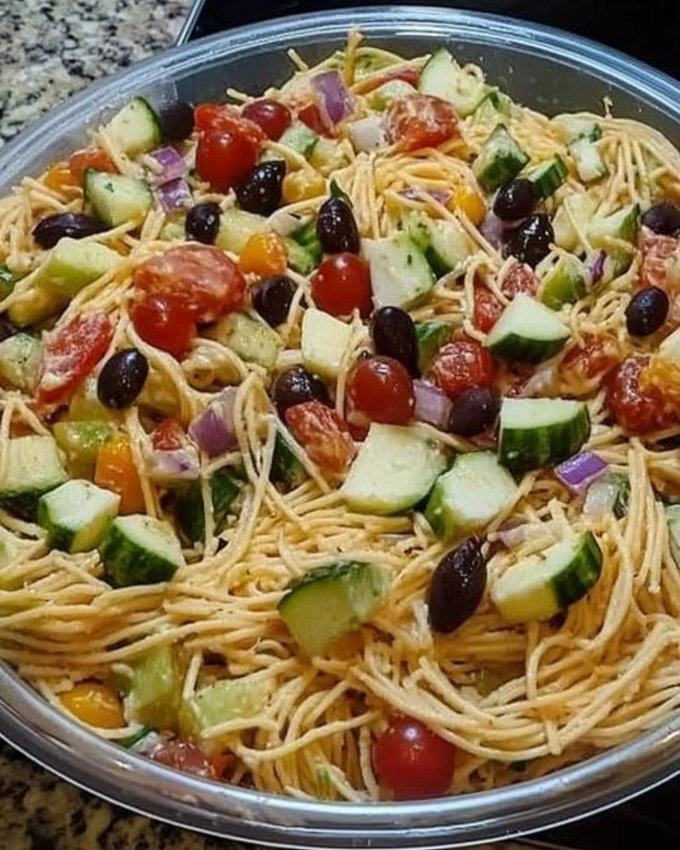 Delicious spaghetti salad with fresh vegetables and dressing