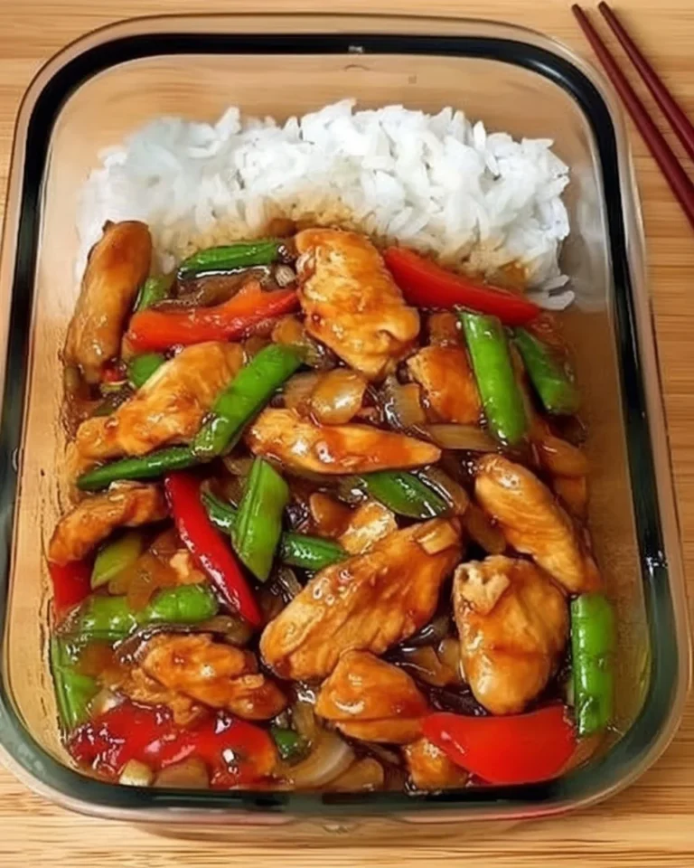 Colorful Chicken and Bell Pepper Stir-Fry served in a bowl with fresh ingredients.