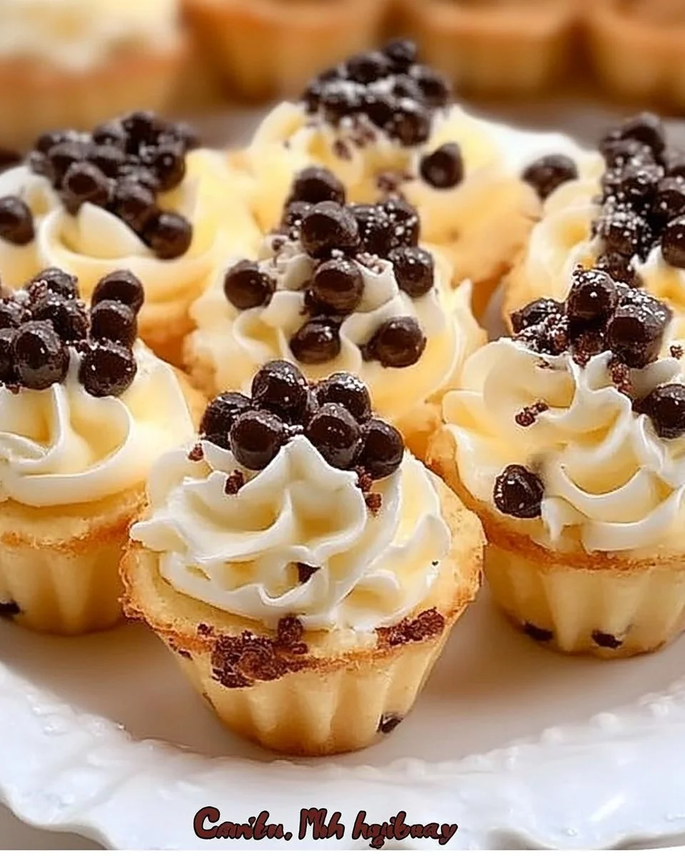 Mini cannoli cups filled with cream on a decorative plate