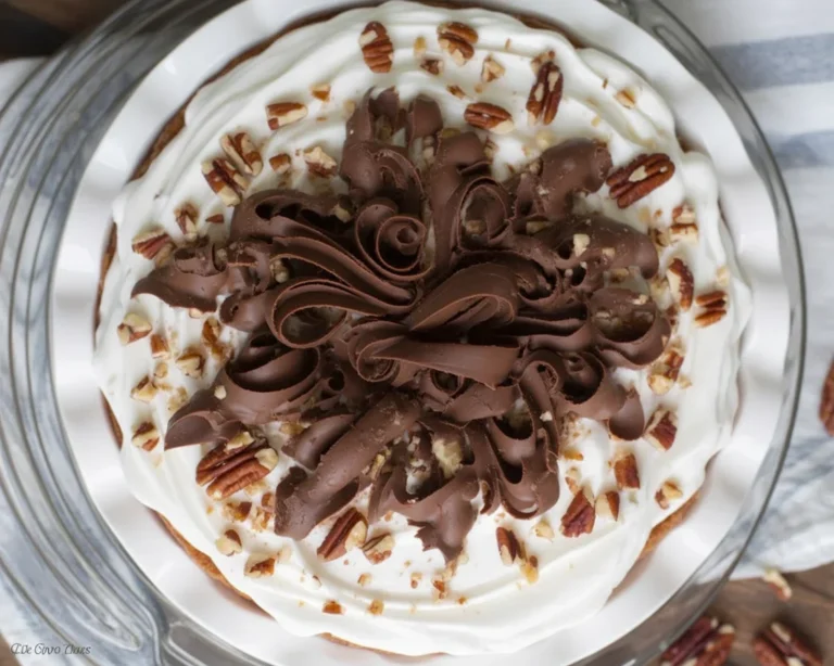 Delicious slice of Possum Pie with layered chocolate and cream cheese filling on a pecan crust