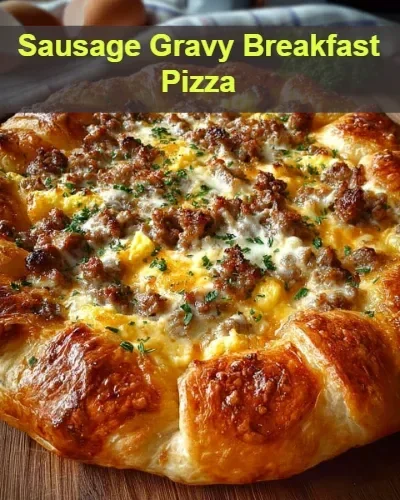 Delicious sausage gravy breakfast pizza topped with cheese and fresh herbs