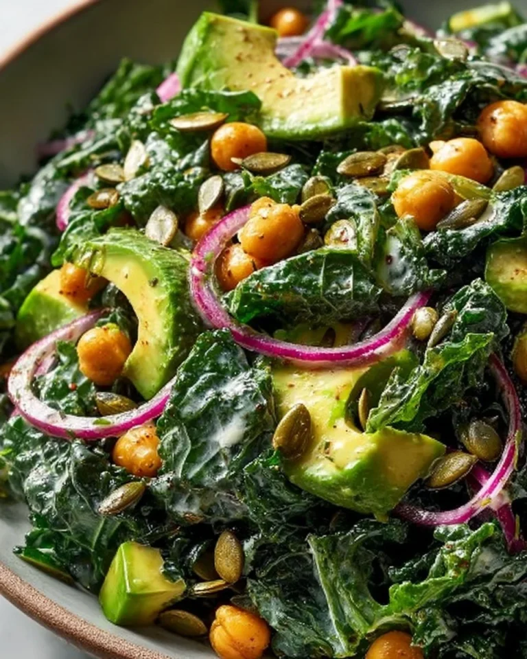 Kale Salad with Chickpeas and Avocado topped with Creamy Garlic Dressing